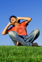 teen boy singing listening to music with headphones